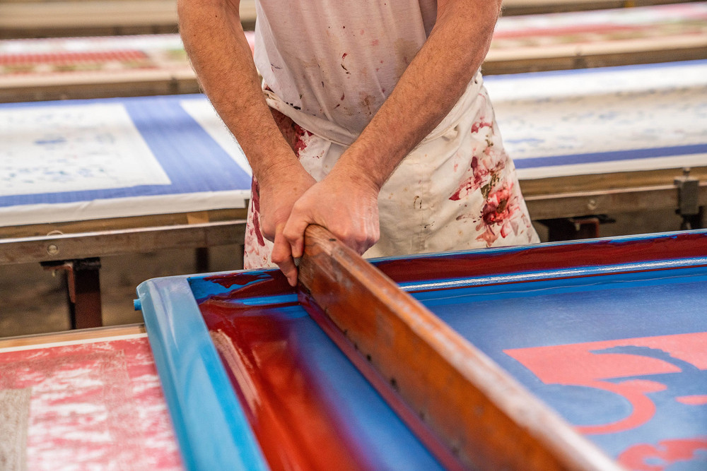 Quality control on artisan printed fabric — premium finishing, La Manufacture MIE Alsace